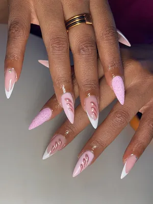 Pink and white almond nails with swirl art